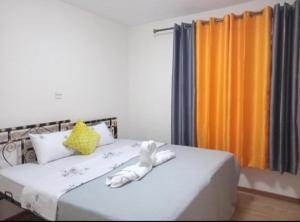 Un pat sau paturi într-o cameră la Casa Tranquilla - JKIA