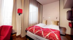 Postel nebo postele na pokoji v ubytování Home Hotel Folketeateret