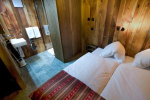 Postel nebo postele na pokoji v ubytování Chalet Z'Gogwärgji