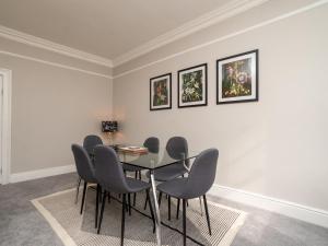a dining room with a table and chairs at Pass the Keys Spacious 3 bed apartment in prime central location in Bath