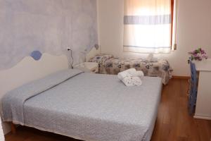 Ένα ή περισσότερα κρεβάτια σε δωμάτιο στο Villa Valentina Park