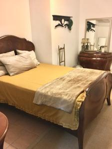 Postel nebo postele na pokoji v ubytování Villa Romana