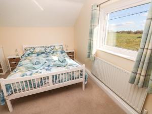 Un pat sau paturi într-o cameră la Meadow View