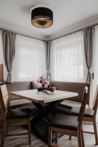 a dining room with a table and a couch at Ferienhaus Bergler Hoamat in Navis