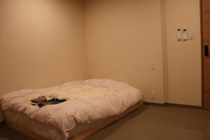 Letto o letti in una camera di 城崎温泉 小宿 紬 tsumugi