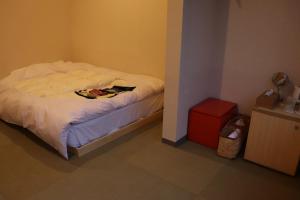 Letto o letti in una camera di 城崎温泉 小宿 紬 tsumugi