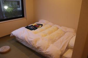 Letto o letti in una camera di 城崎温泉 小宿 紬 tsumugi