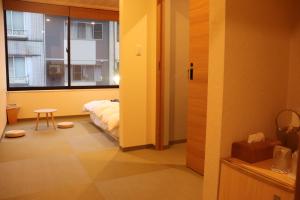 Letto o letti in una camera di 城崎温泉 小宿 紬 tsumugi