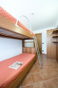 Katil atau katil-katil dalam bilik di Residence Campo Smith