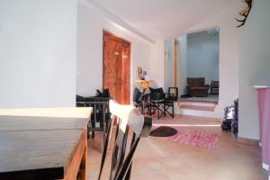 a living room with a table and chairs in a room at Kochab Sintra by LovelyStay in Sintra