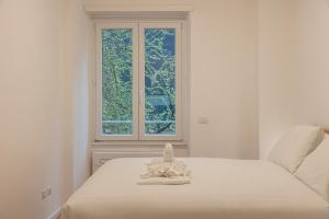 Tempat tidur dalam kamar di Provincie apartment-Rental in Rome