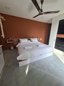 Postel nebo postele na pokoji v ubytování Merijaan Maldives