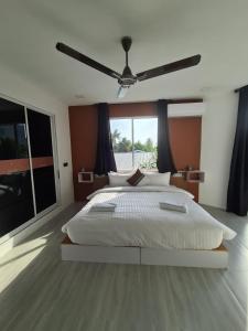 Tempat tidur dalam kamar di Merijaan Maldives