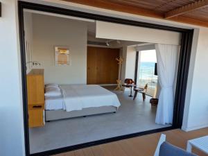 Postel nebo postele na pokoji v ubytování Y & P LATCHI HOTEL