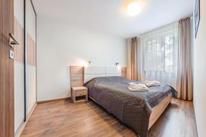 Katil atau katil-katil dalam bilik di Apartamenty Sun & Snow Marina