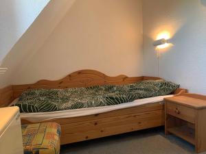 En eller flere senge i et værelse på Friesenhof am Deich