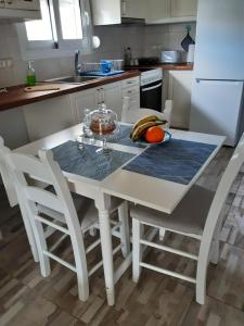A kitchen or kitchenette at The Prickly Pear Apartment