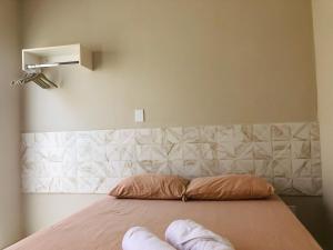 En eller flere senge i et værelse på Kalug - Suíte CASAL independente em Guest house