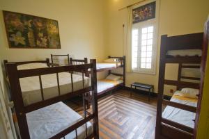 Cama ou camas em um quarto em Guanaaní Hostel