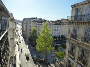 a view of a street in a city with buildings at Vieux Port Appartement Maritime de 72m² et balcon in Marseille