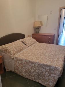 Posteľ alebo postele v izbe v ubytovaní Casa vacanza lifra 2
