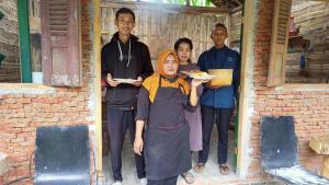 a group of people standing outside of a building at Kali Catur Resort in Madiun +63 photos