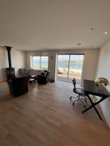 a large living room with chairs and a table at Villa Amalie in Egernsund