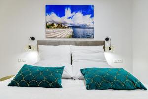a bedroom with two pillows on a bed at Luxury penthouse Marina - Sukošan in Sukošan