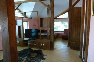 a living room with a tv on a stand at Hotel Grivitsa in Pleven