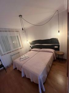 Ένα ή περισσότερα κρεβάτια σε δωμάτιο στο ENTRECAMIÑOS +7 φωτογραφίες