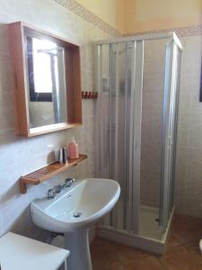 a bathroom with a sink and a shower at Agriturismo Bufano in Cagli