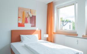 Postel nebo postele na pokoji v ubytování Dietrich-Bonhoeffer-Hotel Berlin Mitte