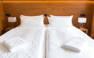Postel nebo postele na pokoji v ubytování Dietrich-Bonhoeffer-Hotel Berlin Mitte