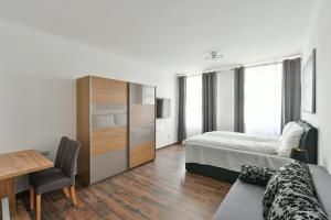 Posteľ alebo postele v izbe v ubytovaní Apartmány Na Náměstí 85