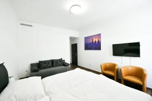 Posteľ alebo postele v izbe v ubytovaní Apartmány Na Náměstí 85