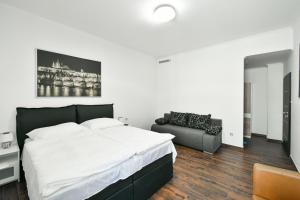 Posteľ alebo postele v izbe v ubytovaní Apartmány Na Náměstí 85