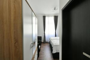 Posteľ alebo postele v izbe v ubytovaní Apartmány Na Náměstí 85