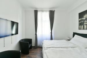 Posteľ alebo postele v izbe v ubytovaní Apartmány Na Náměstí 85