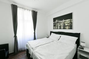 Posteľ alebo postele v izbe v ubytovaní Apartmány Na Náměstí 85
