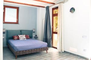 a bedroom with a bed and a window at Poggio Angelarosa: Lemon Garden Stay&Relax in Scala +26 photos