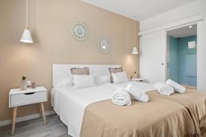 Łóżko lub łóżka w pokoju w obiekcie Apartamento Buganvilla