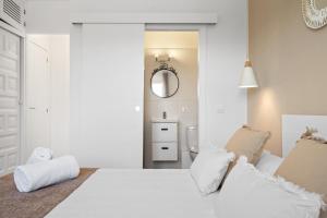Łóżko lub łóżka w pokoju w obiekcie Apartamento Buganvilla