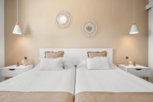 Łóżko lub łóżka w pokoju w obiekcie Apartamento Buganvilla