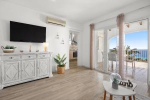 Telewizja i/lub zestaw kina domowego w obiekcie Apartamento Buganvilla