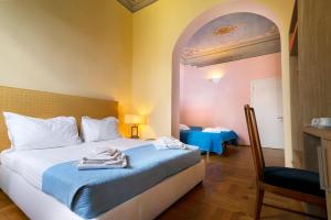 Postel nebo postele na pokoji v ubytování Hotel la Scala