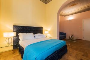 Postel nebo postele na pokoji v ubytování Hotel la Scala