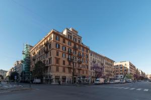 a large brick building on a city street at CS Vatican Charming Apartment in Rome