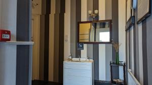 a bathroom with a sink and a mirror on the wall at Areawest in Scarborough