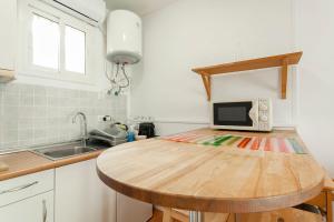 Kuchyňa alebo kuchynka v ubytovaní SAGRADA FAMILIA APARTAMENT + 2 fotografie