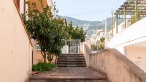 a set of stairs leading up to a building at Casa dei Lentischi in Cala Gonone